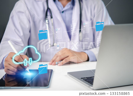 doctor using a tablet to manage electronic health records (EHR) and electronic medical records (EMR) with cloud storage. digital healthcare technology, cloud computing, and medical record management. doctor using a tablet to manage electronic health records (EHR) and electronic medical records (EMR) with cloud storage. digital healthcare technology, cloud computing, and medical record management. 133158865