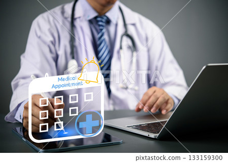 Doctor using digital tablet and laptop with medical appointment calendar icon, online booking system, e-health scheduling, and digital healthcare technology concept. 133159300