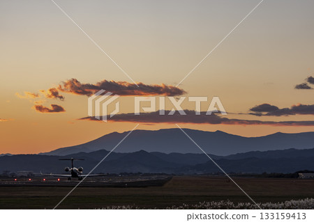 Sendai Airport at dusk, airplane taking off, Natori City, Miyagi Prefecture 133159413