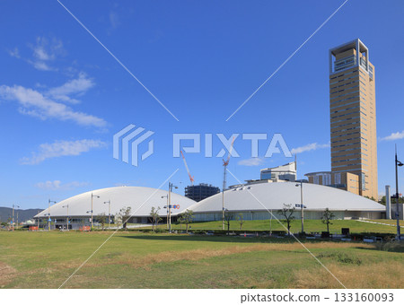 View of Anabuki Arena Kagawa and Takamatsu Symbol Tower from the seafront promenade side of Sunport Takamatsu 133160093