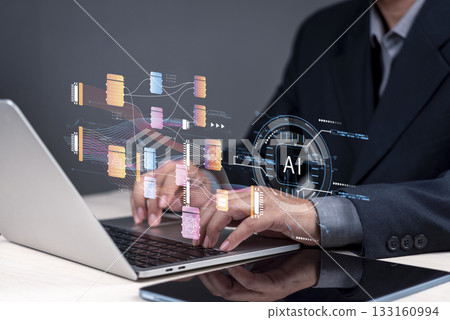 Concept artificial intelligence and machine learning. A man using a portable computer with an AI diagram displayed, coding technology in big data analysis and future innovation. 133160994