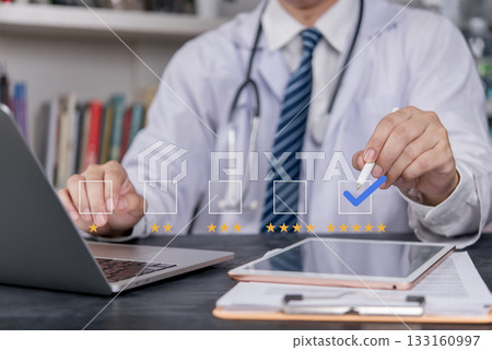 Doctor reviewing online healthcare service quality evaluation results. High review scores indicate customer satisfaction, international medical standards. hospital services. 133160997
