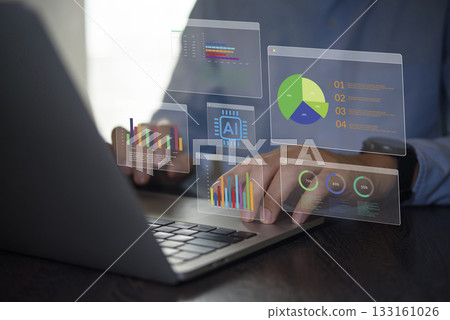 Artificial intelligence business analytics, modern data analysis. Man working with laptop on financial report and marketing strategy. AI technology solution for business growth and corporate success. 133161026