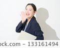 Japanese woman holding a laptop on a white background 133161494