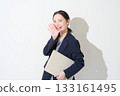 Japanese woman holding a laptop on a white background 133161495