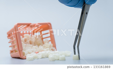 Dental Crown Selection with Tweezers and Shopping Basket Dental Crown Selection with Tweezers and Shopping Basket 133161869