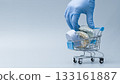 Dentist Hand with Glove Holding Dental Casts in Shopping Cart 133161887