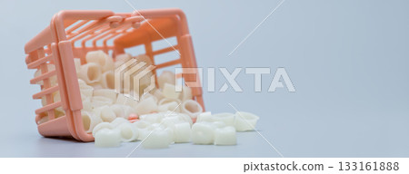 Spilled Dental Crowns from Tipped Shopping Basket Spilled Dental Crowns from Tipped Shopping Basket 133161888