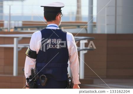Police officers guarding the airport Back view Security Metropolitan Police Department 133162204