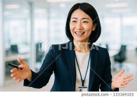Smiling female business leader giving a presentation Smiling female business leader giving a presentation 133164103