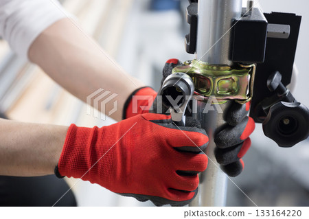 Construction work such as clamps to secure pipes 133164220