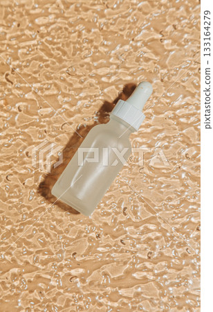 Transparent jar on wavy glass background Transparent jar on wavy glass background 133164279