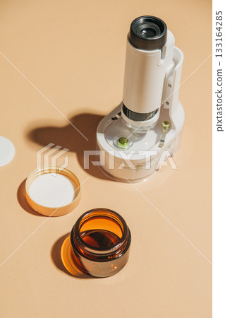 Cosmetic containers with miniature microscope arrangement 133164285