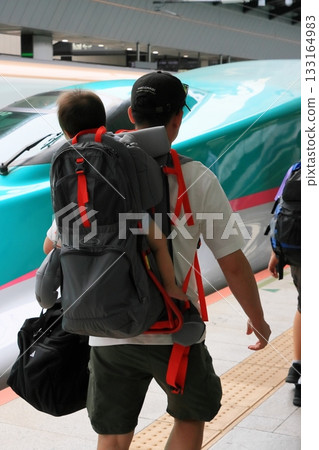 Foreign tourists boarding the Tohoku Shinkansen with children on their backs Foreign tourists boarding the Tohoku Shinkansen with children on their backs 133164983