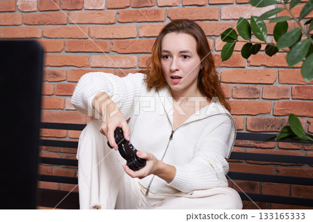 A gamer plays a game A gamer plays a game 133165333