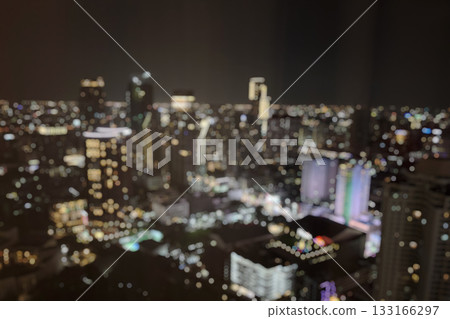 Abstract blur cityscape skyline building night light bokeh background Abstract blur cityscape skyline building night light bokeh background 133166297