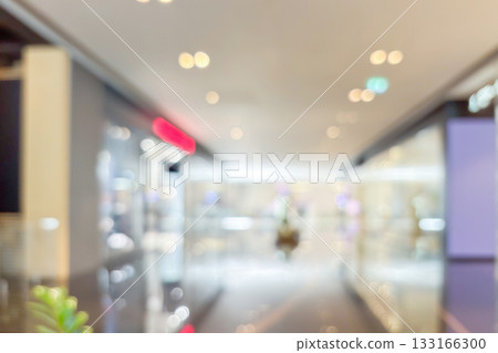 modern luxury shopping mall department store interior blur abstract background with bokeh light 133166300