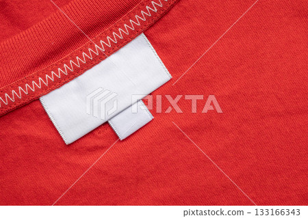White blank laundry care clothes label on shirt fabric background 133166343