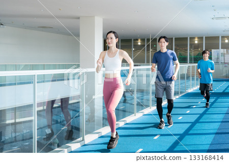 Young men and women training at a sports gym. Photo courtesy of Sports Club & Sauna Spa Renaissance Makuhari 24 Young men and women training at a sports gym. Photo courtesy of Sports Club & Sauna Spa Renaissance Makuhari 24 133168414