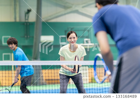 Young men and women playing tennis at a sports gym. Photo courtesy of Sports Club & Sauna Spa Renaissance Makuhari 24 Young men and women playing tennis at a sports gym. Photo courtesy of Sports Club & Sauna Spa Renaissance Makuhari 24 133168489