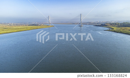Aerial view of the river Rio Guadiana with the puente internacional del Guadiana 133168824