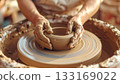 Potter shaping clay into vessel 133169022