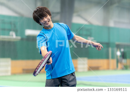 A young man playing tennis at a sports gym. Photo courtesy of Sports Club & Sauna Spa Renaissance Makuhari 24 133169511