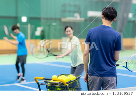 Young men and women playing tennis at a sports gym. Photo courtesy of Sports Club & Sauna Spa Renaissance Makuhari 24 133169537