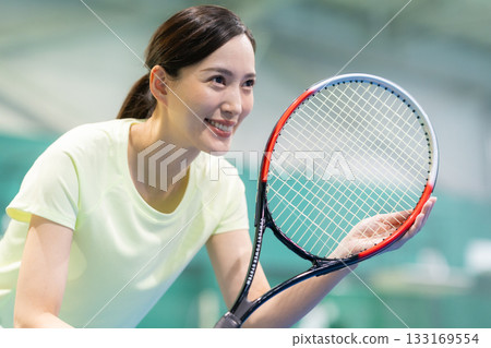 A young woman playing tennis at a sports gym. Photo courtesy of Sports Club & Sauna Spa Renaissance Makuhari 24 133169554
