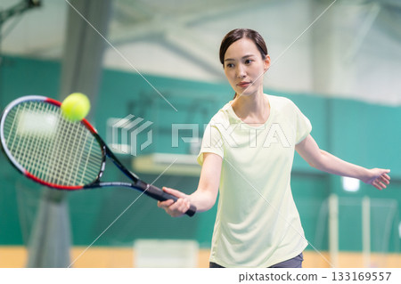 A young woman playing tennis at a sports gym. Photo courtesy of Sports Club & Sauna Spa Renaissance Makuhari 24 A young woman playing tennis at a sports gym. Photo courtesy of Sports Club & Sauna Spa Renaissance Makuhari 24 133169557