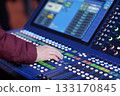 sound engineer controls live sound mixing console 133170845