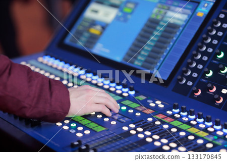sound engineer controls live sound mixing console sound engineer controls live sound mixing console 133170845