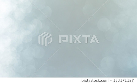 Soft blue bokeh background with gentle circular light shapes and a clean, minimal aesthetic. Perfect for use in design projects, winter themes, technology concepts 133171187