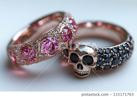 Pair of gold wedding rings with a bold pattern on a white background. Original design. Pair of gold wedding rings with a bold pattern on a white background. Original design. 133171763