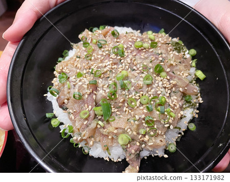 Aji no Namero Donburi: A local dish of rice bowl topped with finely chopped fresh horse mackerel. Aji no Namero Donburi: A local dish of rice bowl topped with finely chopped fresh horse mackerel. 133171982