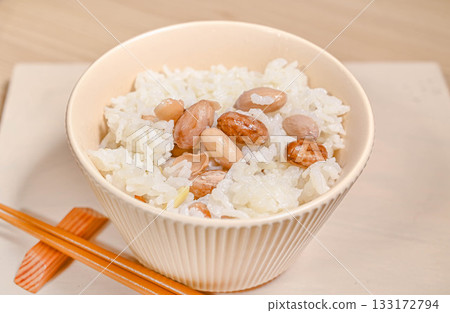 Rice cooked with raw peanuts 133172794