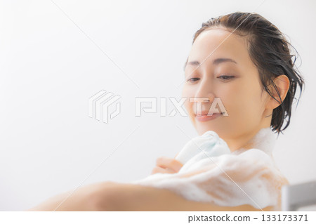 A woman taking a bath A woman taking a bath 133173371