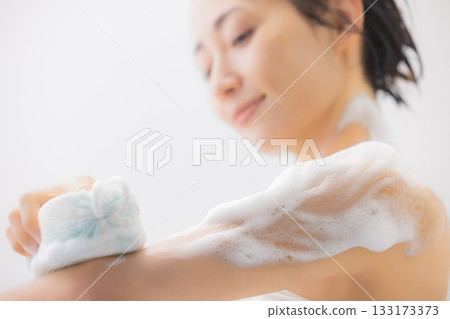 A woman taking a bath A woman taking a bath 133173373