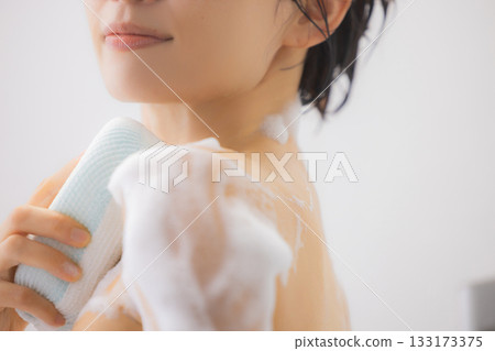 A woman taking a bath A woman taking a bath 133173375