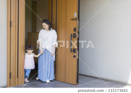Family at the entrance going out Family at the entrance going out 133173682