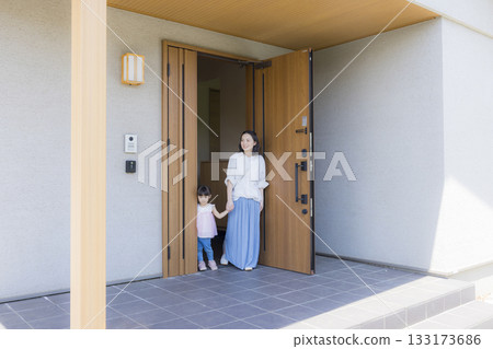 Family at the entrance going out Family at the entrance going out 133173686