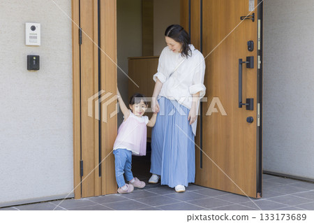 Family at the entrance going out Family at the entrance going out 133173689