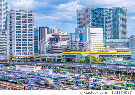 Tokyo cityscape in Japan, with views of the Shinkansen "Doctor Yellow" that brings good fortune, Kansai Electric Power Company, and high-rise apartment buildings in Shibaura 133174057