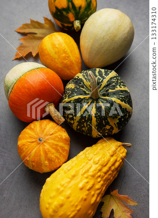Autumn gourds and leaves creating a seasonal still life Autumn gourds and leaves creating a seasonal still life 133174310