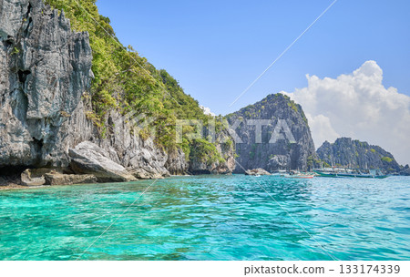 Rocky cliffs of a tropical island in the Philippines. Rocky cliffs of a tropical island in the Philippines. 133174339