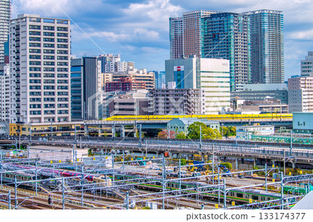 Tokyo cityscape in Japan, with views of the Shinkansen "Doctor Yellow" that brings good fortune, Kansai Electric Power Company, and high-rise apartment buildings in Shibaura 133174377