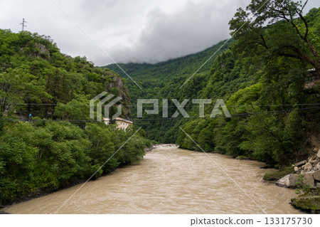 Mountain river in Georgia. River between mountains, cloudy sky 133175730