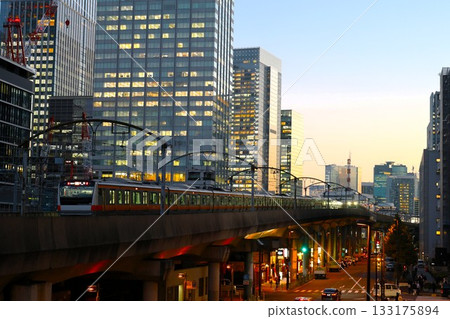 A Chuo Line train running through buildings at dusk A Chuo Line train running through buildings at dusk 133175894