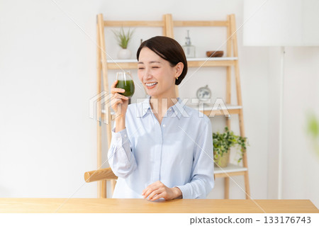 Woman drinking green juice, health food Woman drinking green juice, health food 133176743