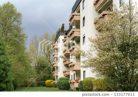 the facade of a residential house with a small part of the house 133177011